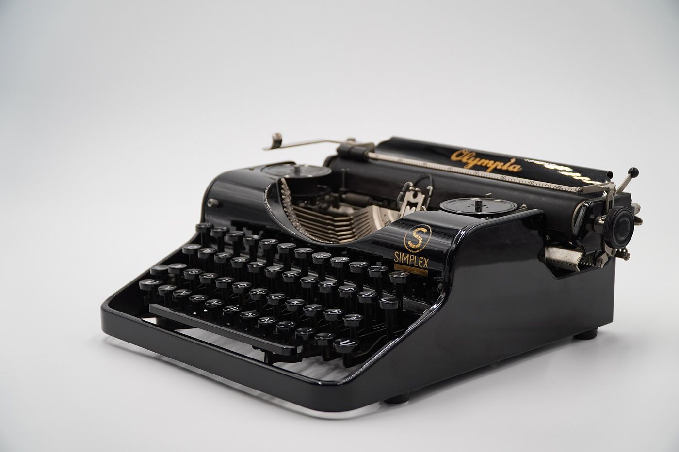 A black Olympia typewriter